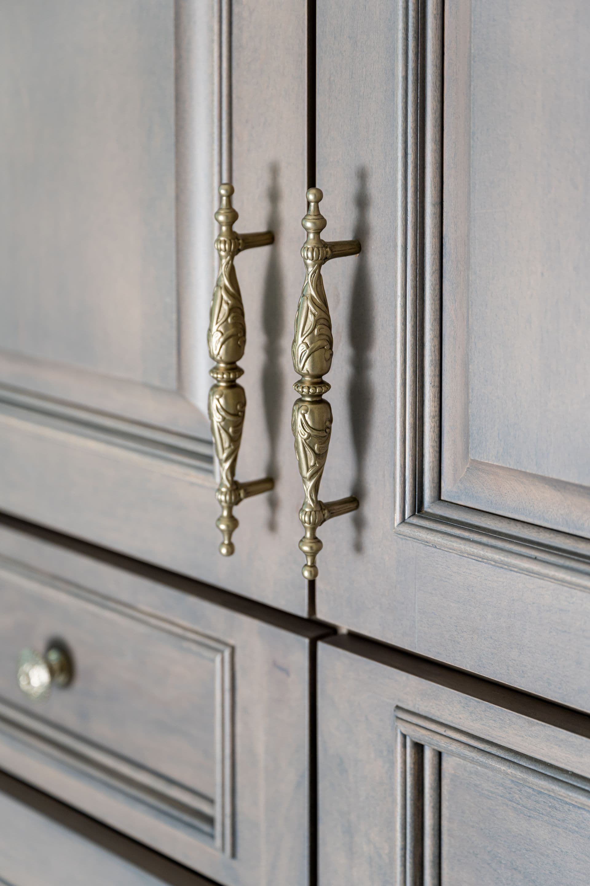 Warm metal vanity hardware and natural finishes