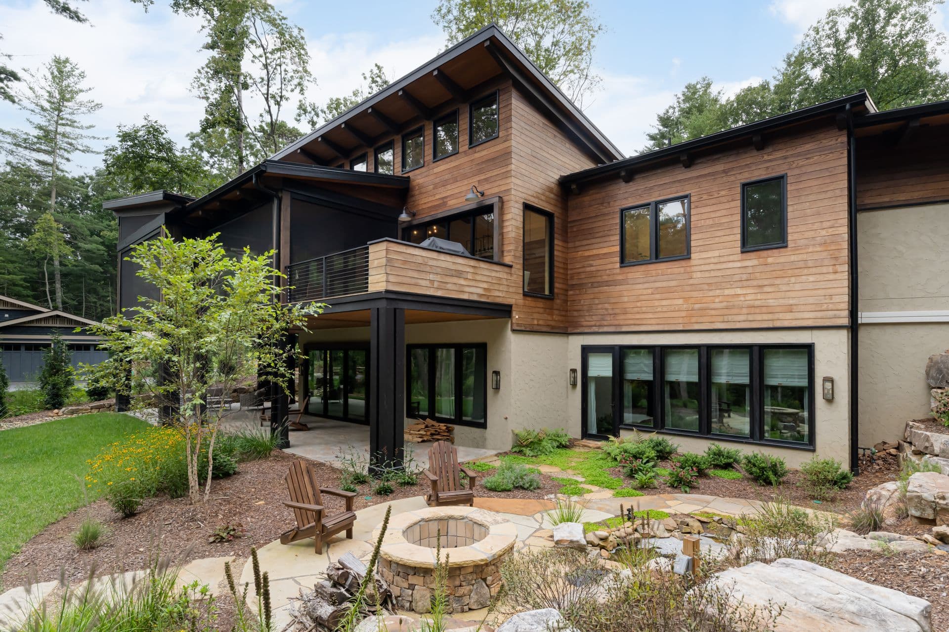 Contemporary wood-and-stone home with a landscaped garden