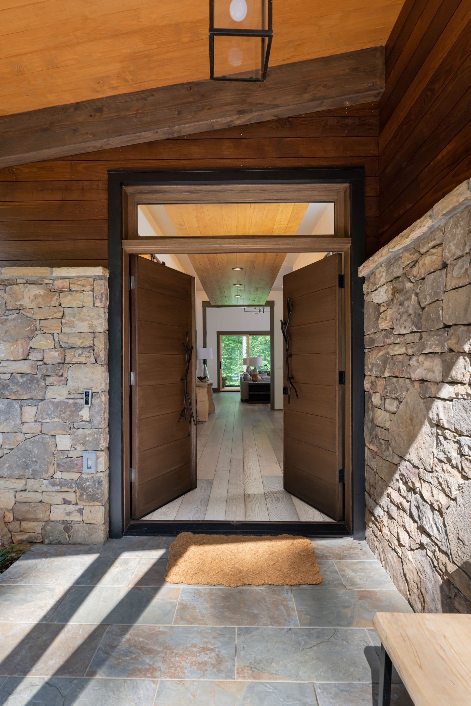 Stone entry passage opening toward the bright interior