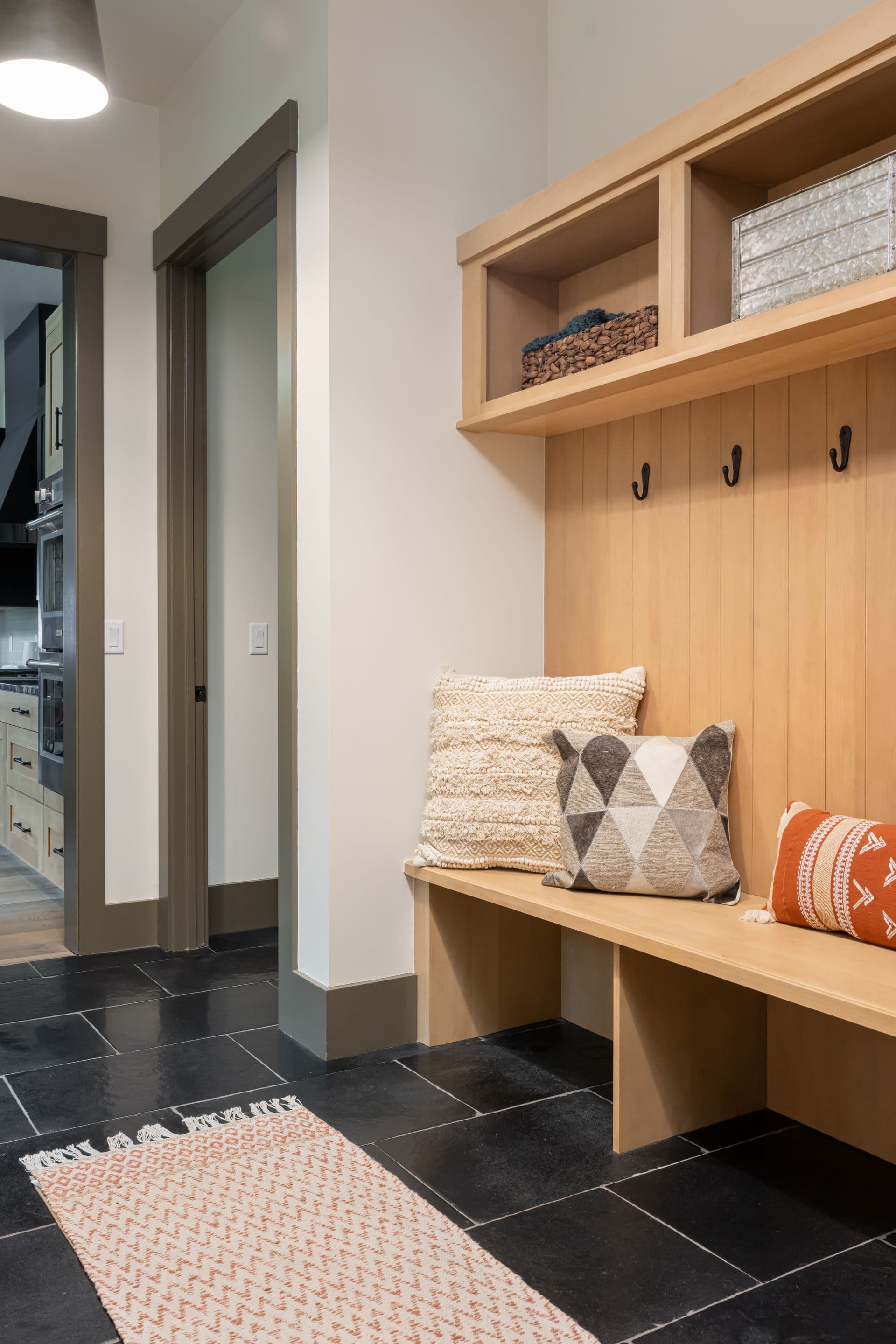 Timber entry bench with built-in storage and coat hooks