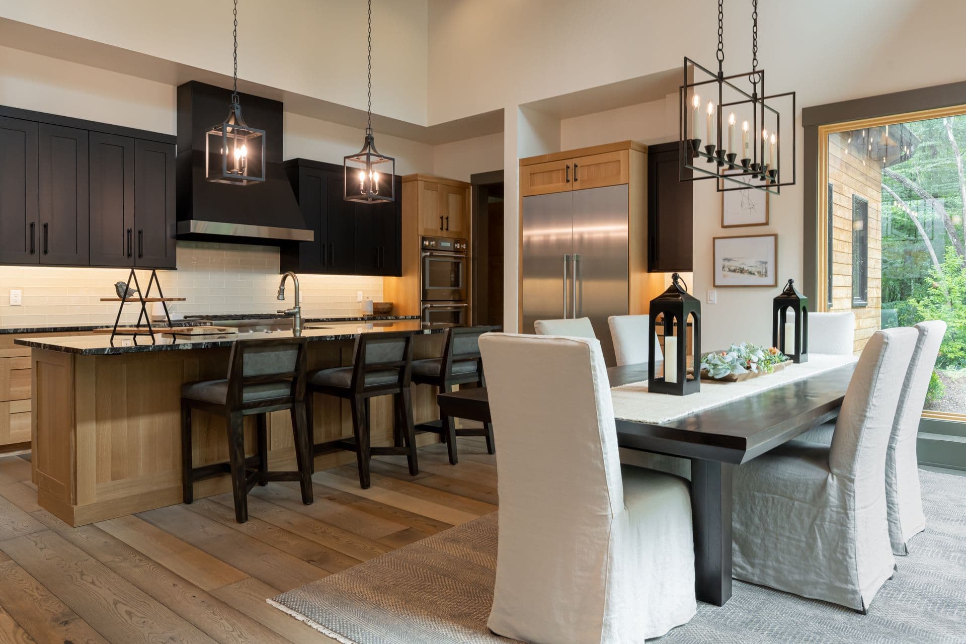 A warm contemporary kitchen and dining room with garden views