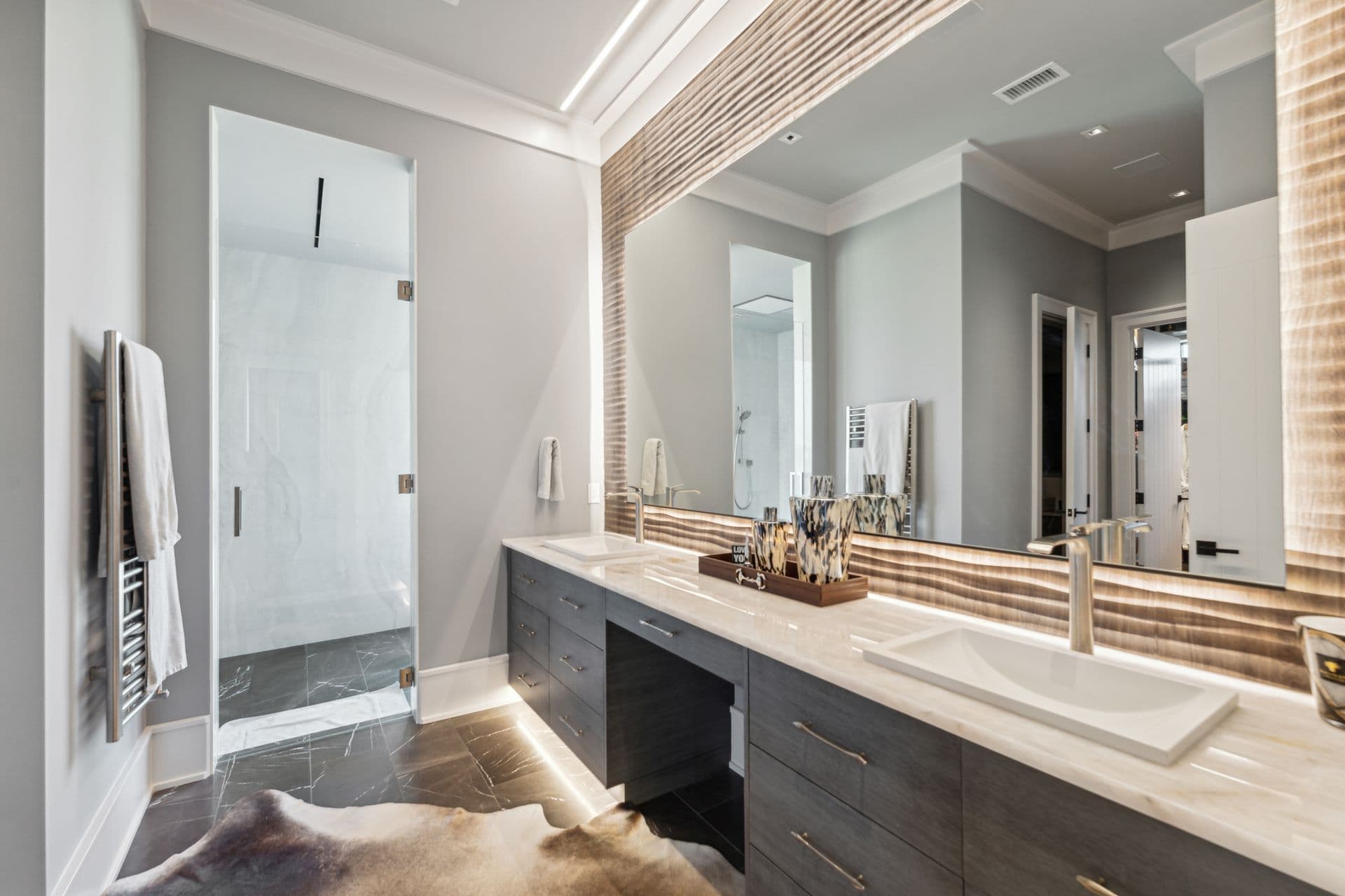 Bathroom vanity with warm wood cabinetry