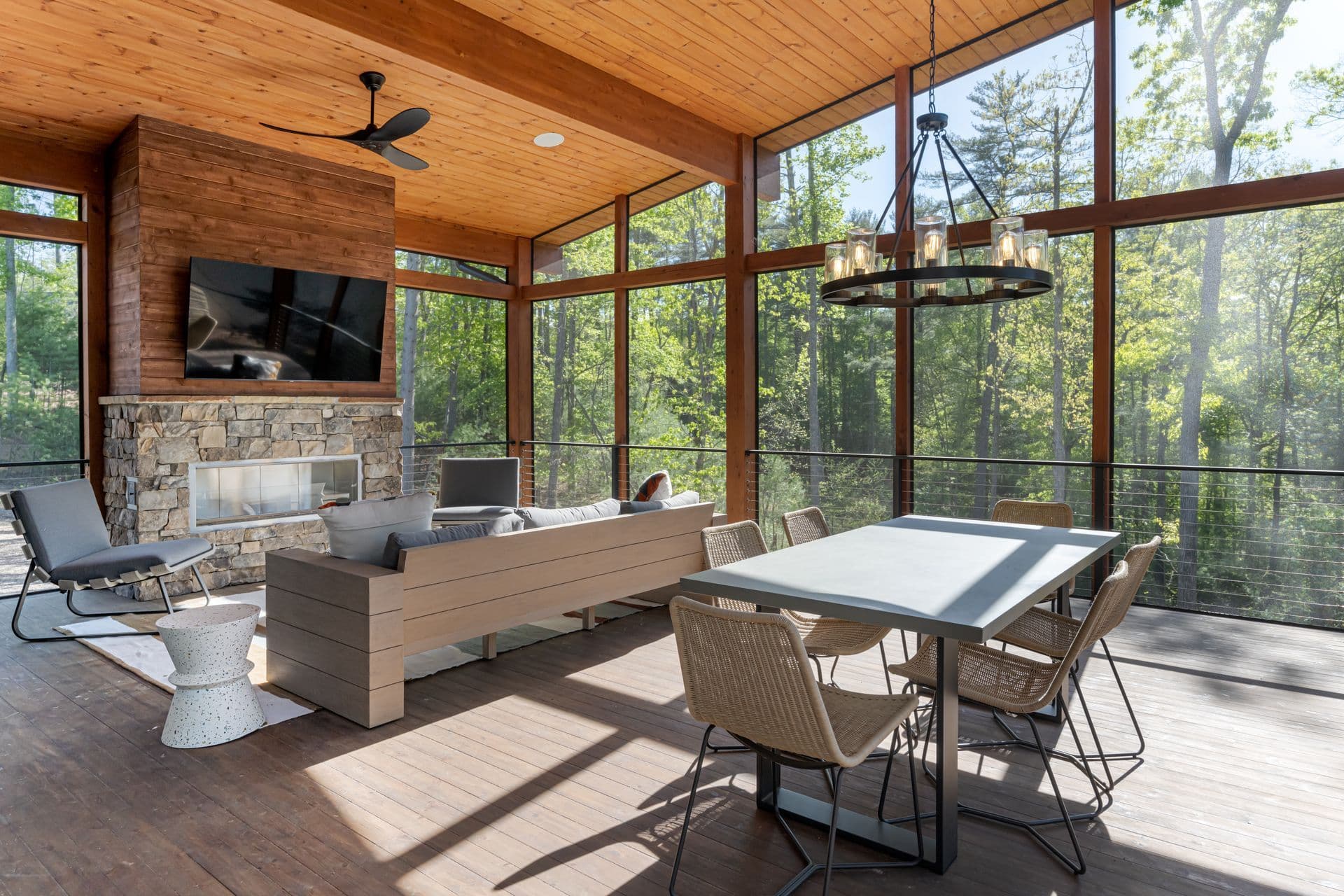 Outdoor porch living space surrounded by greenery