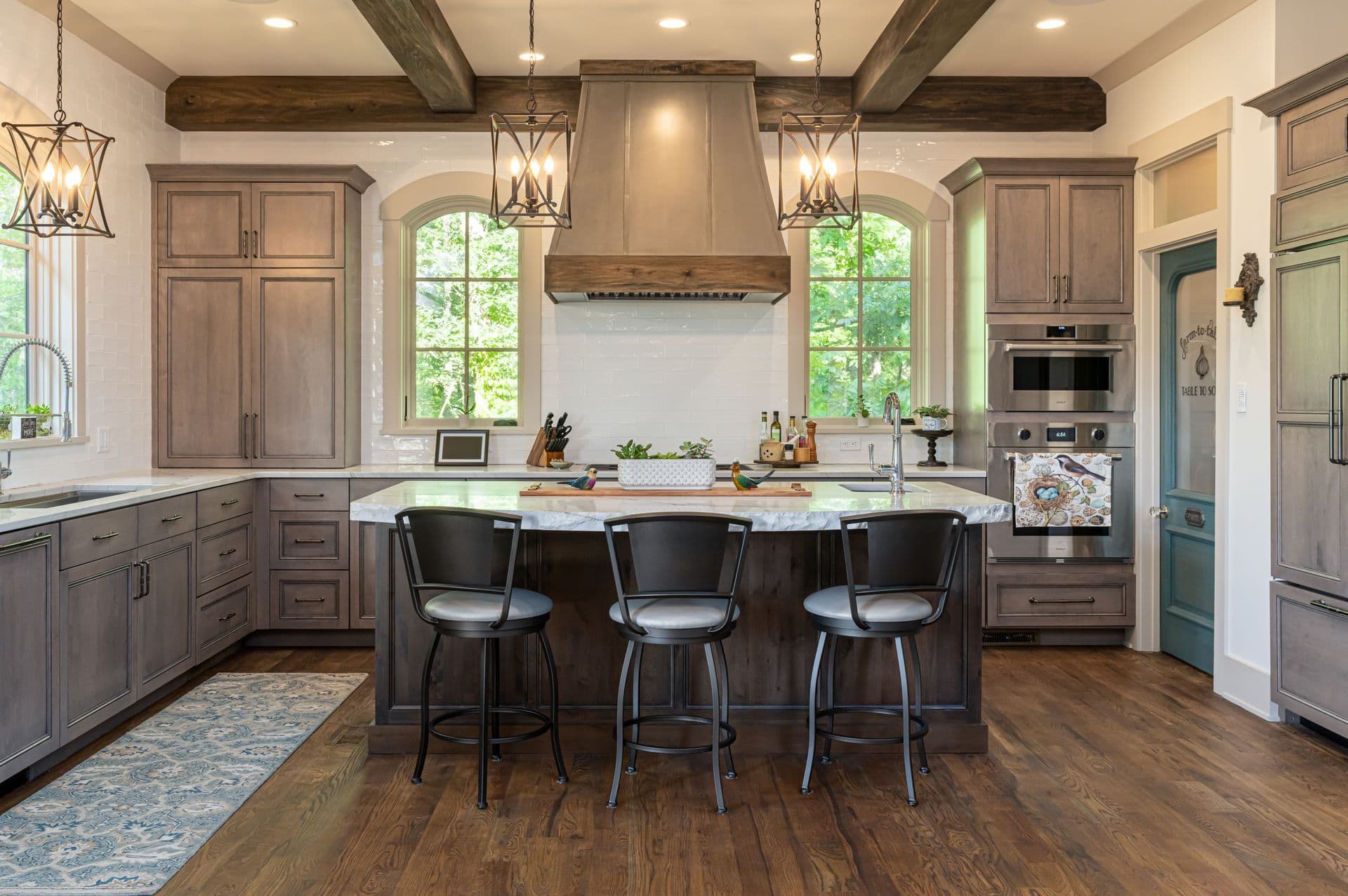 A warm French country kitchen with a generous central island