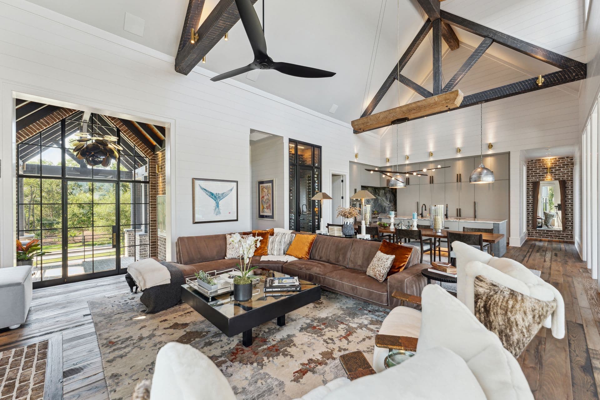 An airy contemporary living room with a dramatic vaulted ceiling